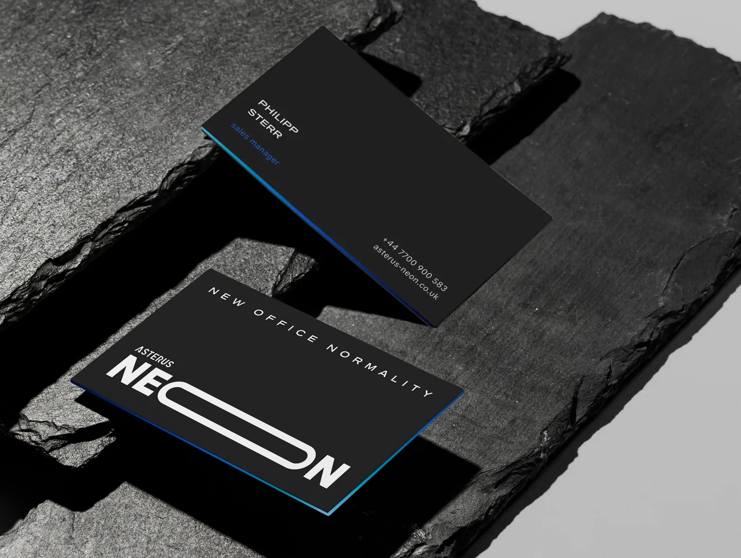 NEON business cards on slate